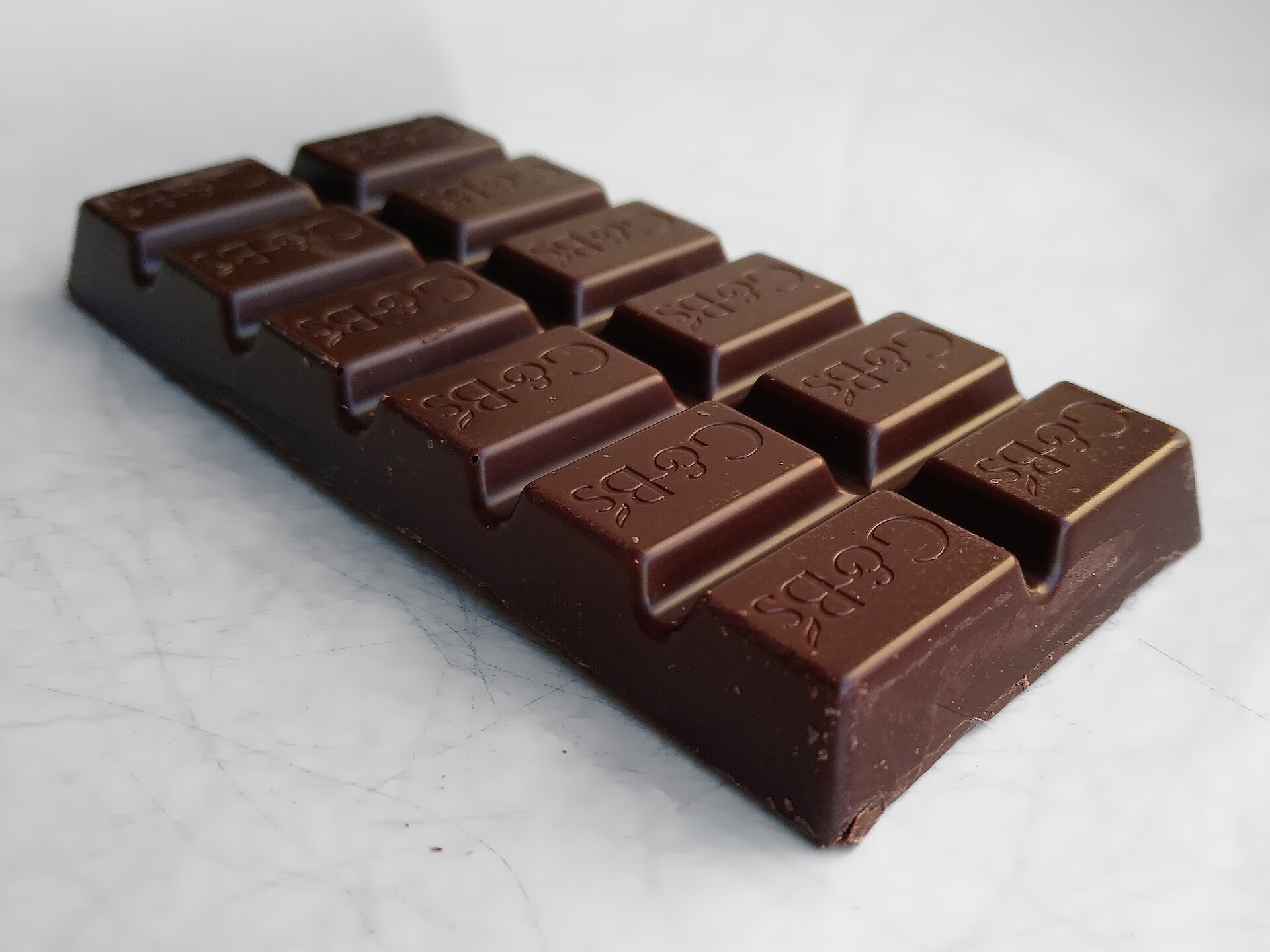 Dark chocolate bar — theobromine in chocolate is toxic to dogs and cats
